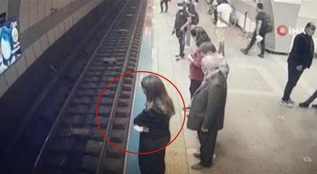 Raylara atlayan genç kız trenin altından burnu bile kanamadan çıktı