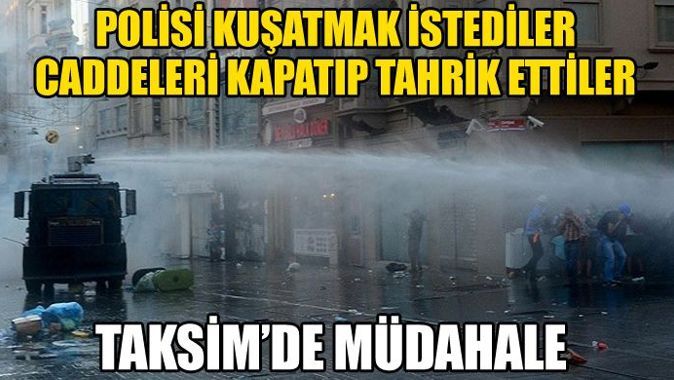 Taksim&#039;de polisi kuşatmaya çalışanlara tazyikli suyla müdahale