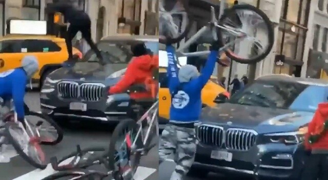 Bisikletli çete New York’un göbeğinde içindekilerle birlikte araca saldırdı