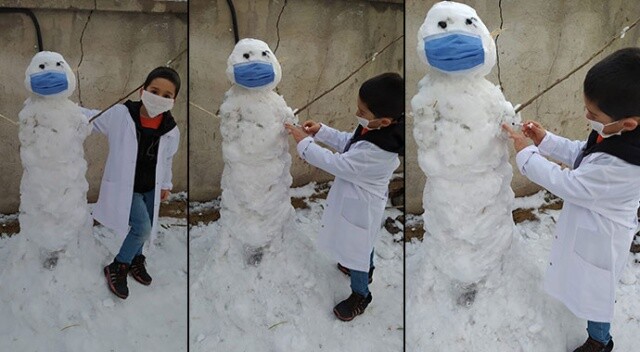 Kardan adama maske takıp koronavirüs aşısı yaptı