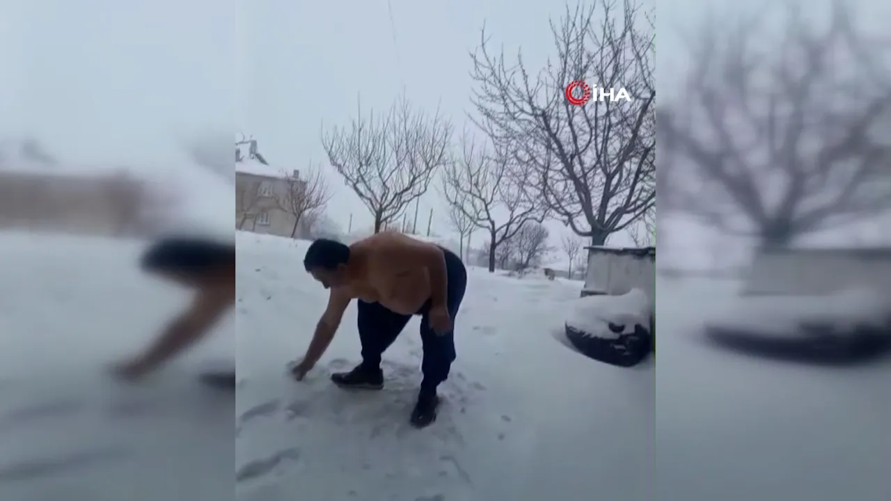 Elazığ'da dondurucu soğuğa meydan okudu! Kar yağışını üstsüz dışarı çıkarak kutladı!