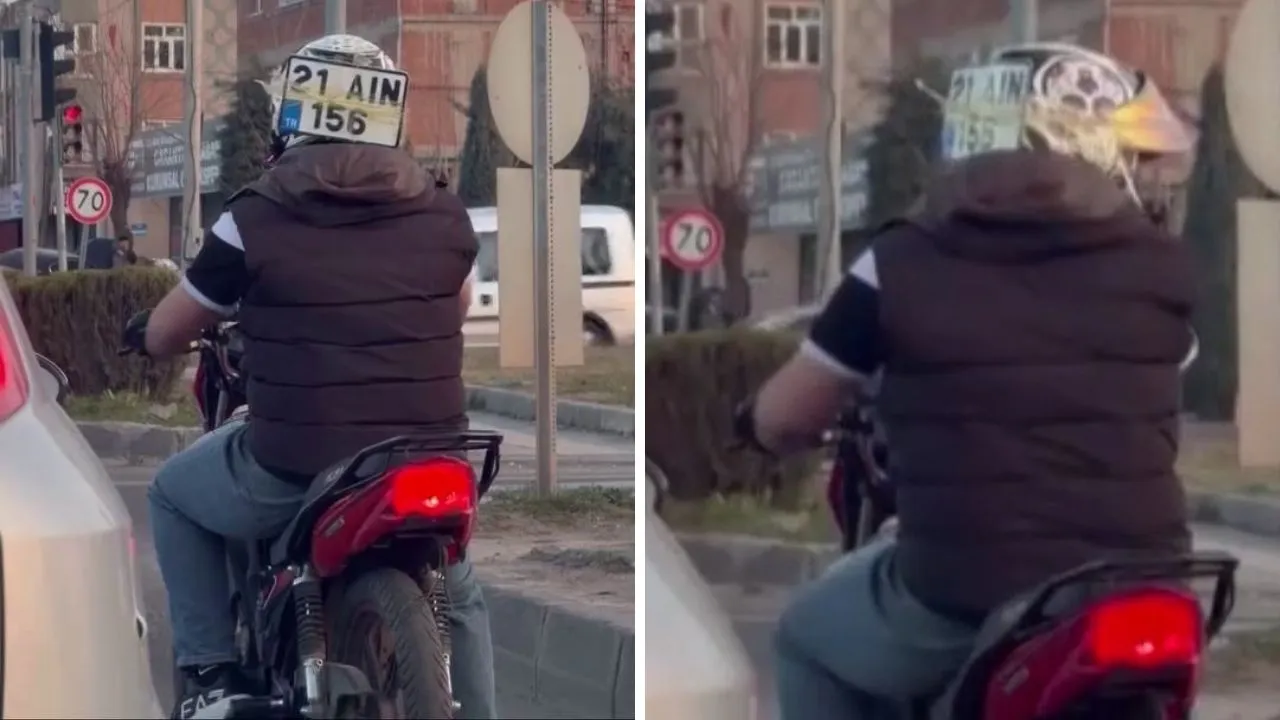 Trafikte gören bir daha baktı! Düşen plakasını kaskına bantlayıp ilerledi