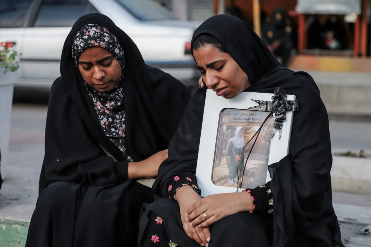 In this picture obtained from Iran's ISNA news agency, mourners attend the funeral of children killed in a reported strike on a primary school in Iran’s Hormozgan province, in Minab on March 3, 2026. Iranian media have reported hundreds of Iranian casualties, including at a girl's school, although AFP reporters have not been able to verify tolls independently. The war launched by the United States and Israel against Iran spread across the Middle East, threatening to plunge the global economy into chaos, with Lebanon and Gulf energy exporters dragged into the conflict. (Photo by AMIRHOSSEIN KHORGOOEI / ISNA / AFP)