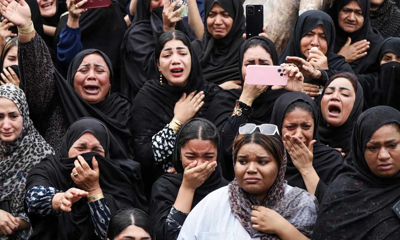 In this picture obtained from Iran's ISNA news agency, mourners cry during the funeral of children killed in a reported strike on a primary school in Iran’s Hormozgan province, in Minab on March 3, 2026. Iranian media have reported hundreds of Iranian casualties, including at a girl's school, although AFP reporters have not been able to verify tolls independently. The war launched by the United States and Israel against Iran spread across the Middle East, threatening to plunge the global economy into chaos, with Lebanon and Gulf energy exporters dragged into the conflict. (Photo by AMIRHOSSEIN KHORGOOEI / ISNA / AFP)