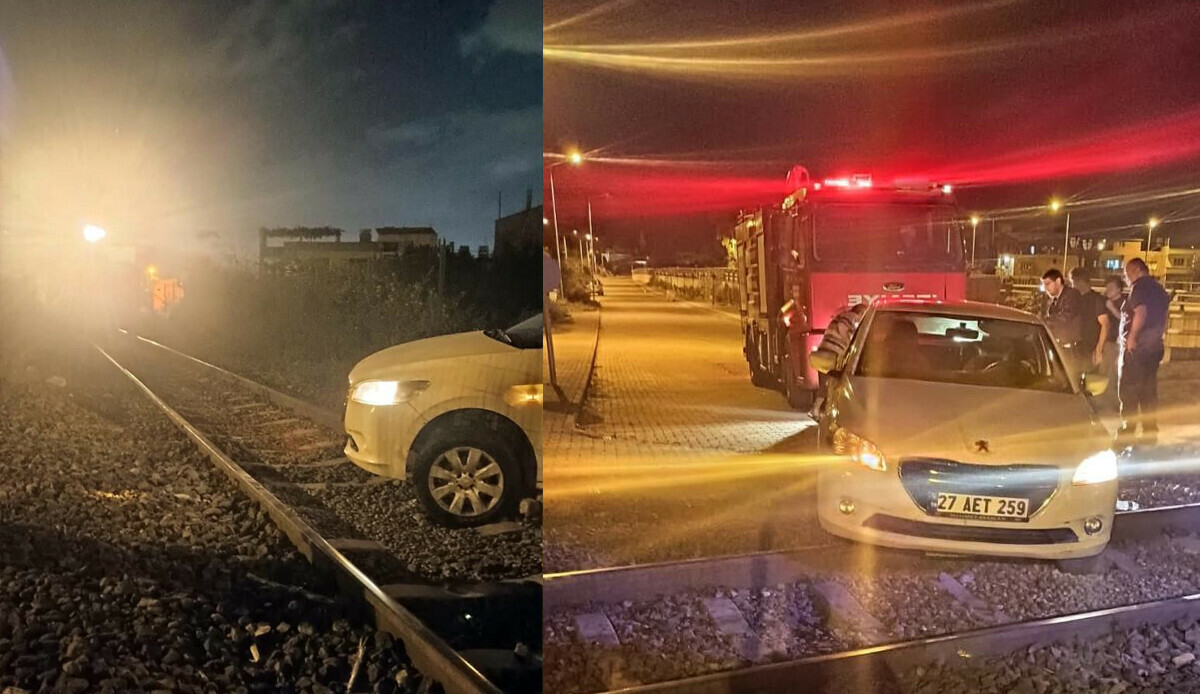 Hatay&#039;da korku dolu anlar! Araba raylara takıldı, tren son anda durduruldu