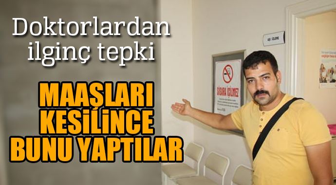 Maaşları kesilince duvarı ikiye böldüler Maaşları kesilince duvarı ikiye böldüler