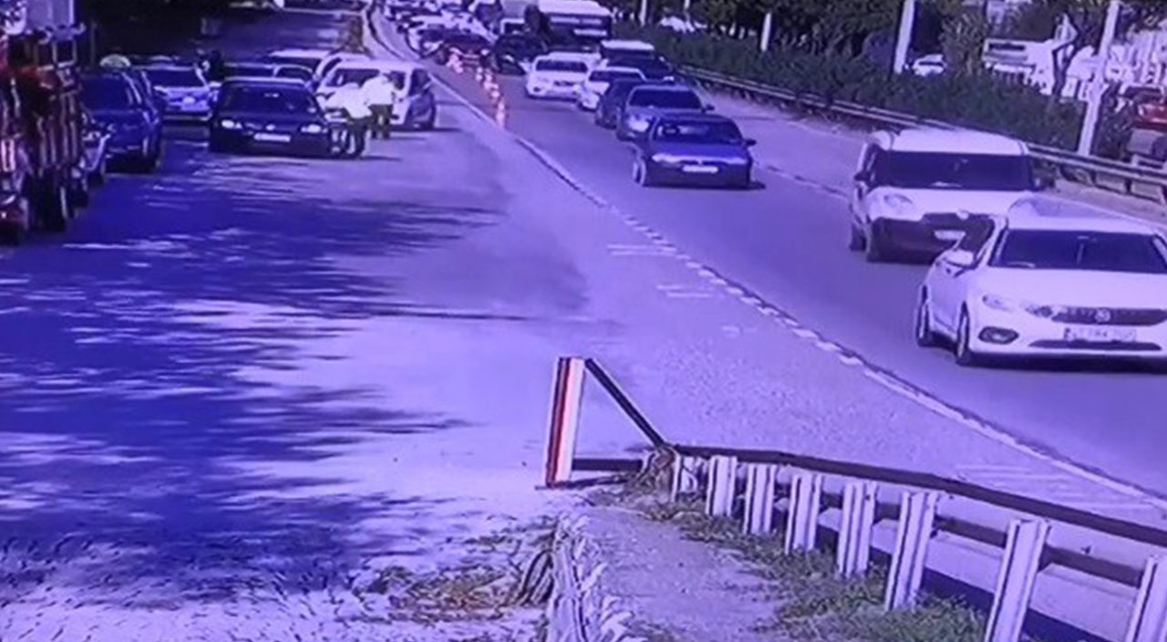 Kendisini durdurmak isteyen trafik polisini otomobiliyle metrelerce sürükledi