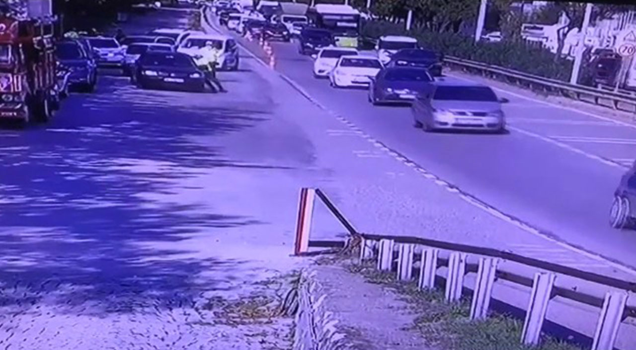 Kendisini durdurmak isteyen trafik polisini otomobiliyle metrelerce sürükledi