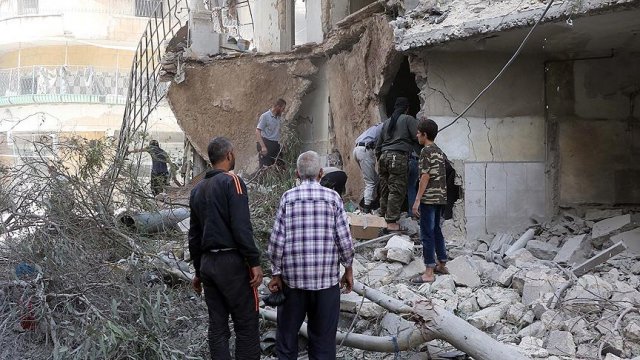 Esed güçleri yerleşim yerini bombaladı: 13 ölü Esed güçleri yerleşim yerini bombaladı: 13 ölü