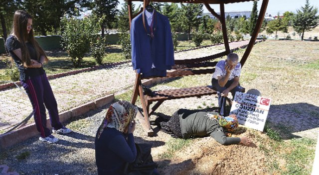 Oğlunun  takım  elbisesini  götürdü