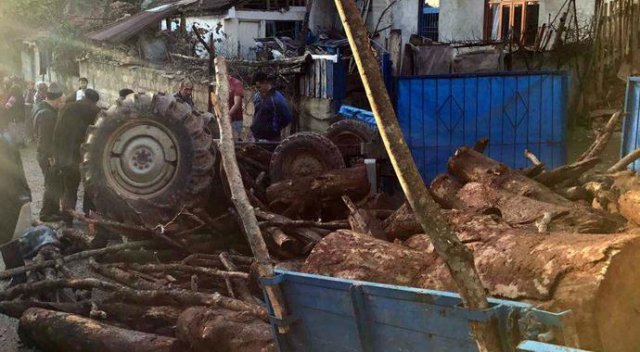 Odun yüklü traktör devrildi, yaralılar var Odun yüklü traktör devrildi, yaralılar var