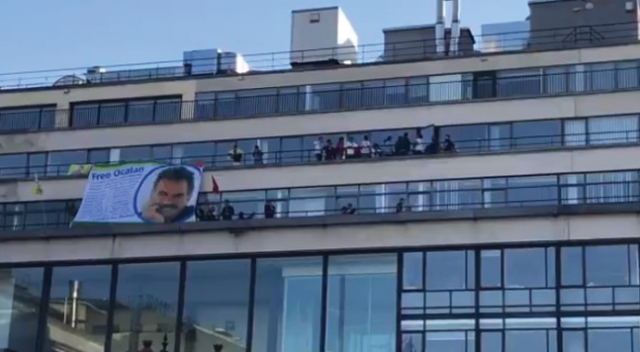 Paris'te skandal görüntü: AFP binasına Öcalan posteri asıldı Paris'te skandal görüntü: AFP binasına Öcalan posteri asıldı