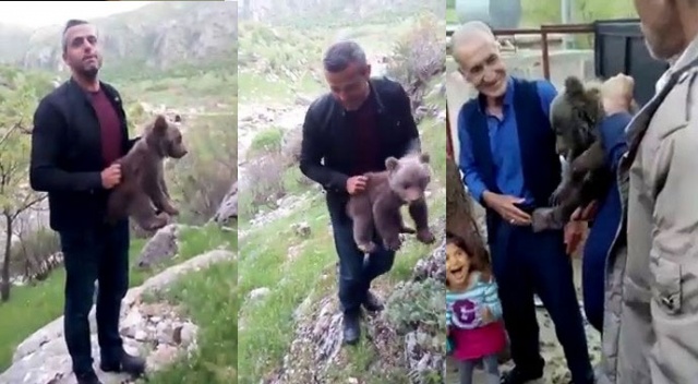 Yavru ayıyla fotoğraf çektirdikten sonra doğaya bıraktılar Yavru ayıyla fotoğraf çektirdikten sonra doğaya bıraktılar