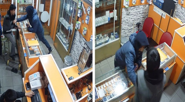 Önce inceledi, ardından çalışana yumruk atıp telefonları alarak kaçtı