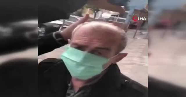 Tepki çeken görüntü! Yaşlı adamı zorla durdurdular, maske takıp başına kolonya döktüler